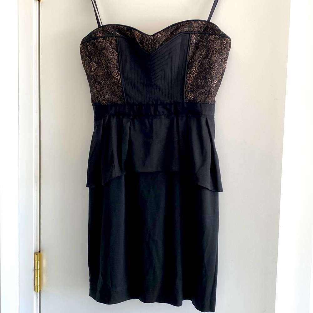 BCBGMAXAZRIA strapless black corset-style mini dress with peplum skirt. Size 2